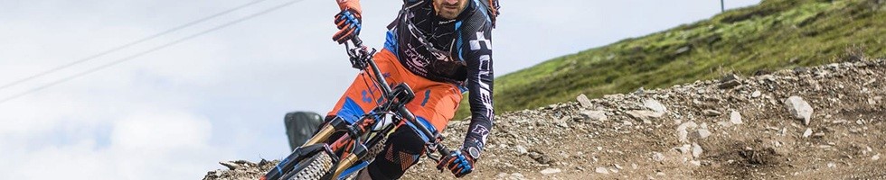 Mountain biker wearing Cube long finger gloves